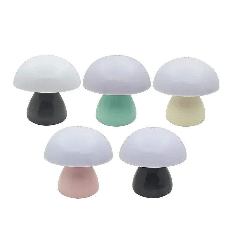 Set of five colorful mushroom-shaped lamps on a white background